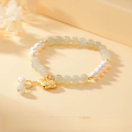 wholesale Real shot of a silver and Hetian jade Ruyi bracelet for women, featuring a luxurious and versatile design with freshwater pearl tassels-0-1